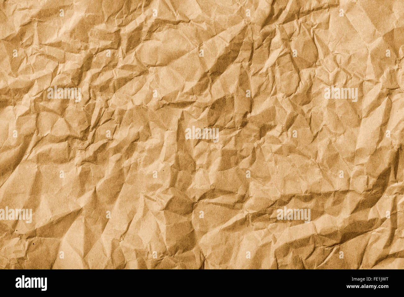 Crumpled brown kraft paper texture as background Stock Photo
