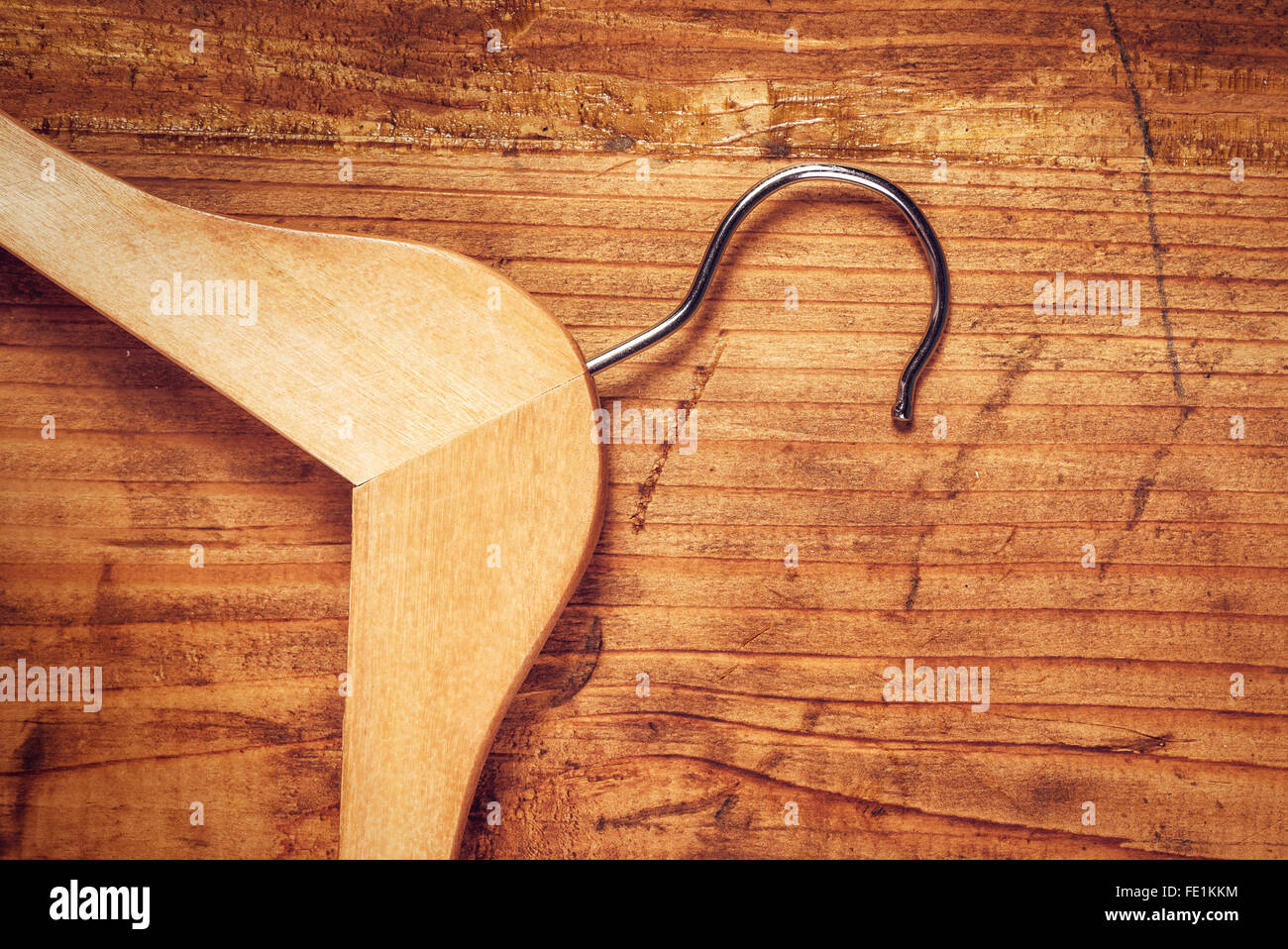 Retro cloth hanger on rustic wooden background, top view with copy space Stock Photo