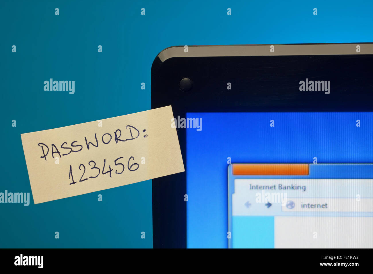 Too easy password on sticky notes on laptop screen. Focus on password Stock Photo