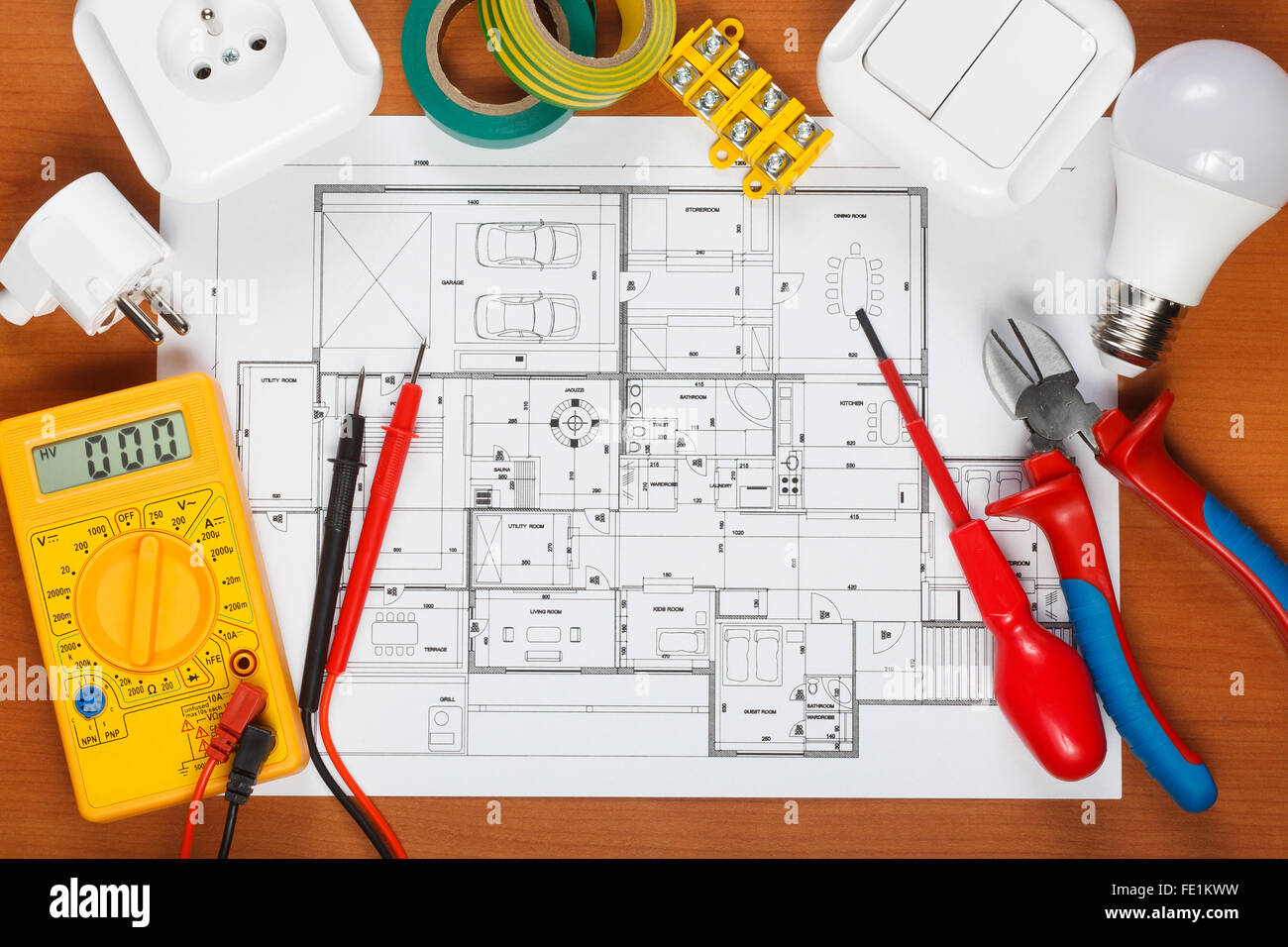 Electrical equipment, tools and house plans on the desk Stock Photo