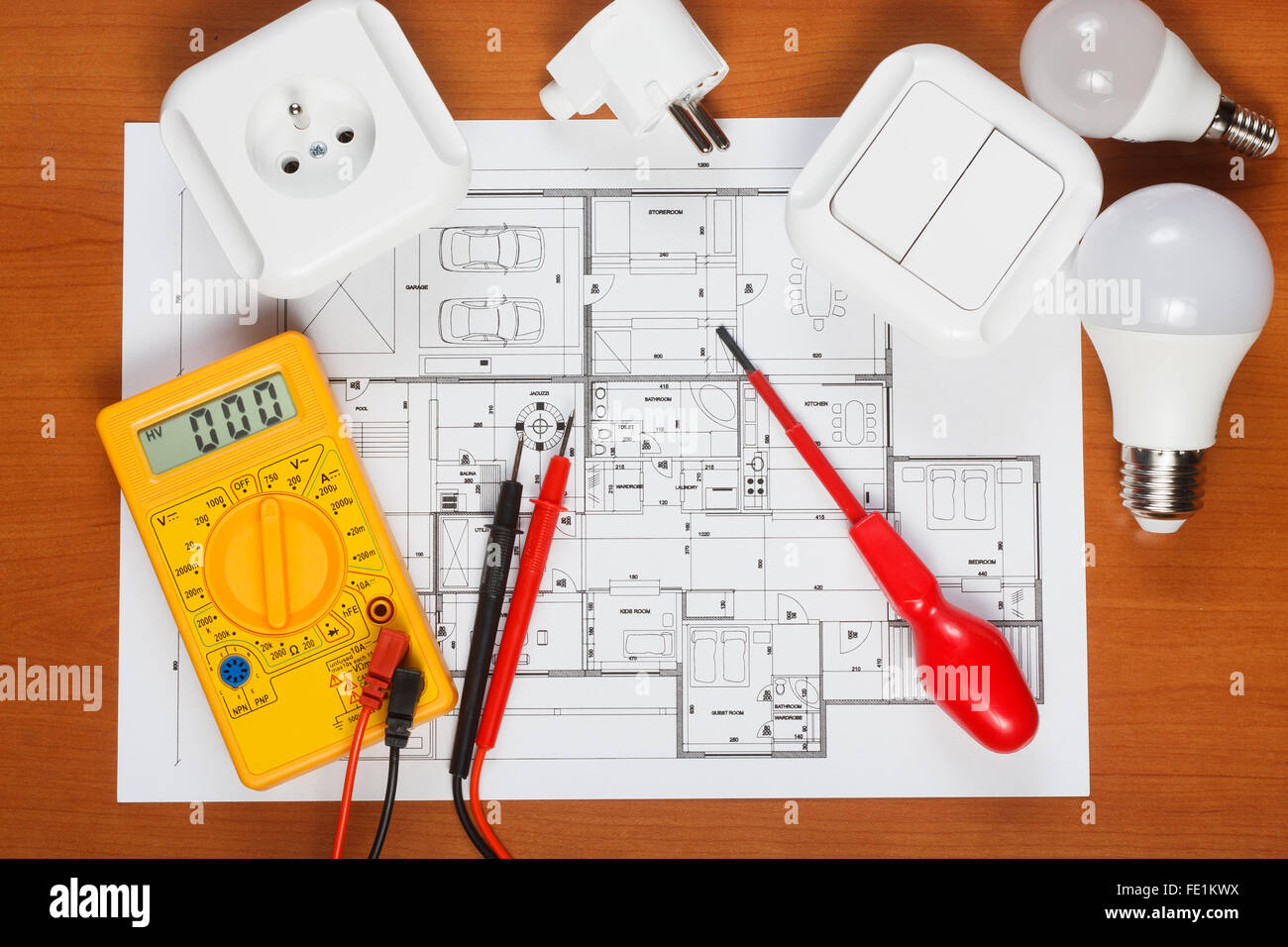 Electrical equipment, tools and house plans on the desk Stock Photo