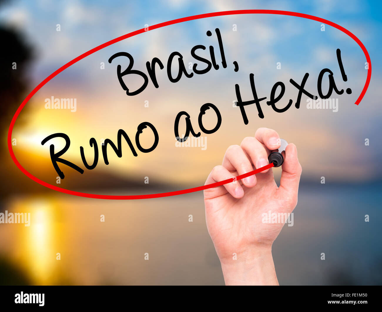 Man Hand writing Brasil, Rumo ao Hexa! with black marker on visual screen. Isolated on background. Business, technology, interne Stock Photo