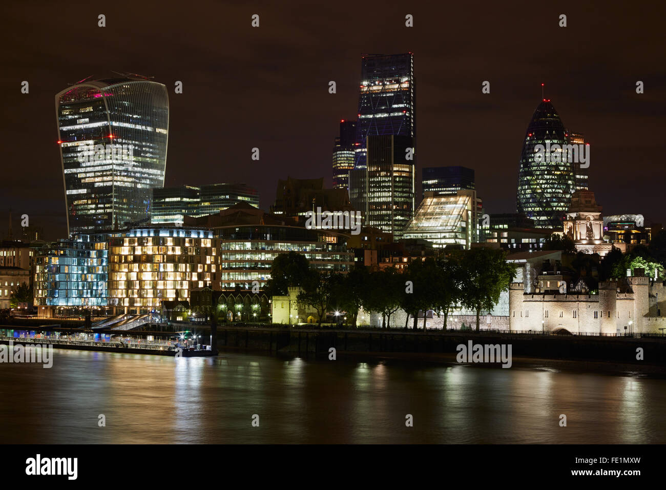 London skyscrapers skyline view illuminated at night with Thames river Stock Photo