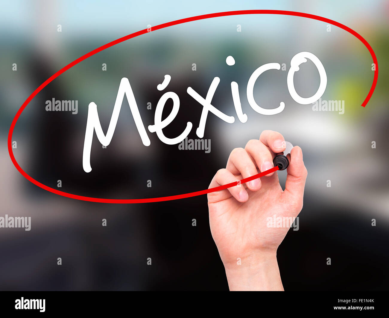Man Hand writing Mexico (In Spanish) with black marker on visual screen ...