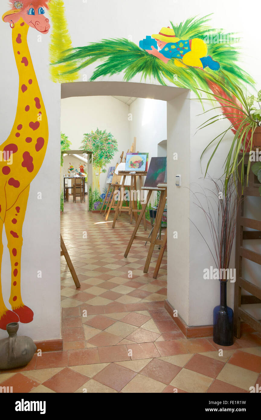 Interior. Drawing classroom entrance with painted colorful animals ...
