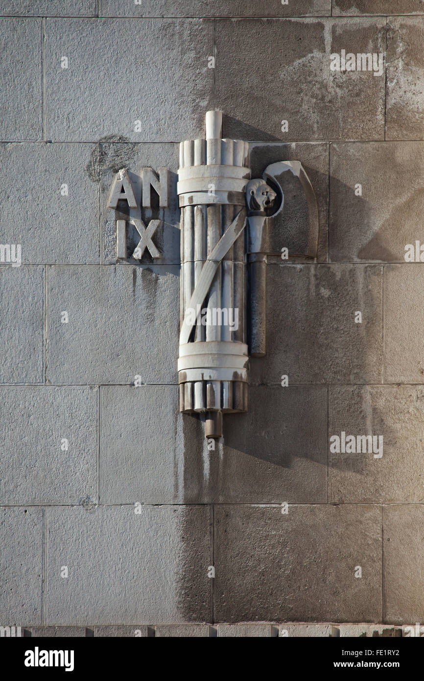 Fascist symbol depicted on the main facade of the Central train station (Stazione di Milano Centrale) in Milan, Lombardy, Italy. Number IX means 9th year of the fascist era (1931). Stock Photo