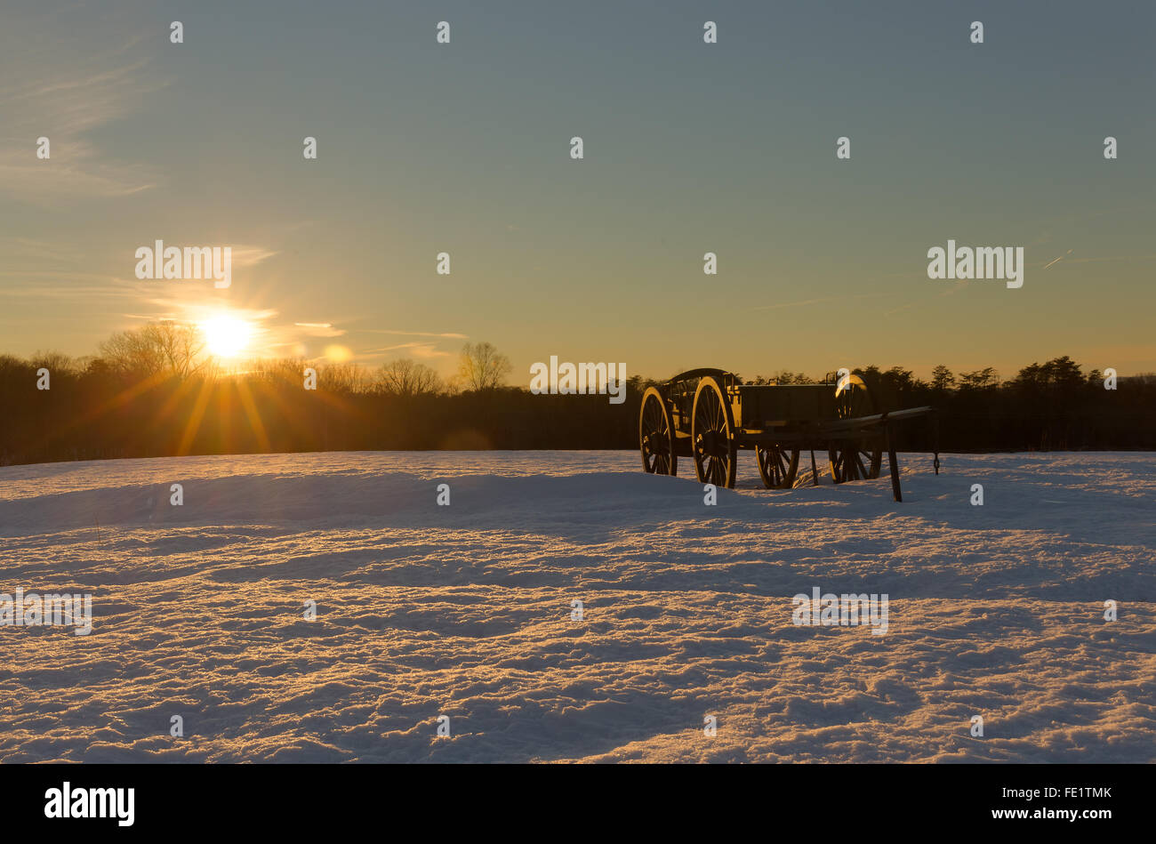 A golden sunset over a snow-covered Manassas Battlefield Park at Henry House Hill Stock Photo