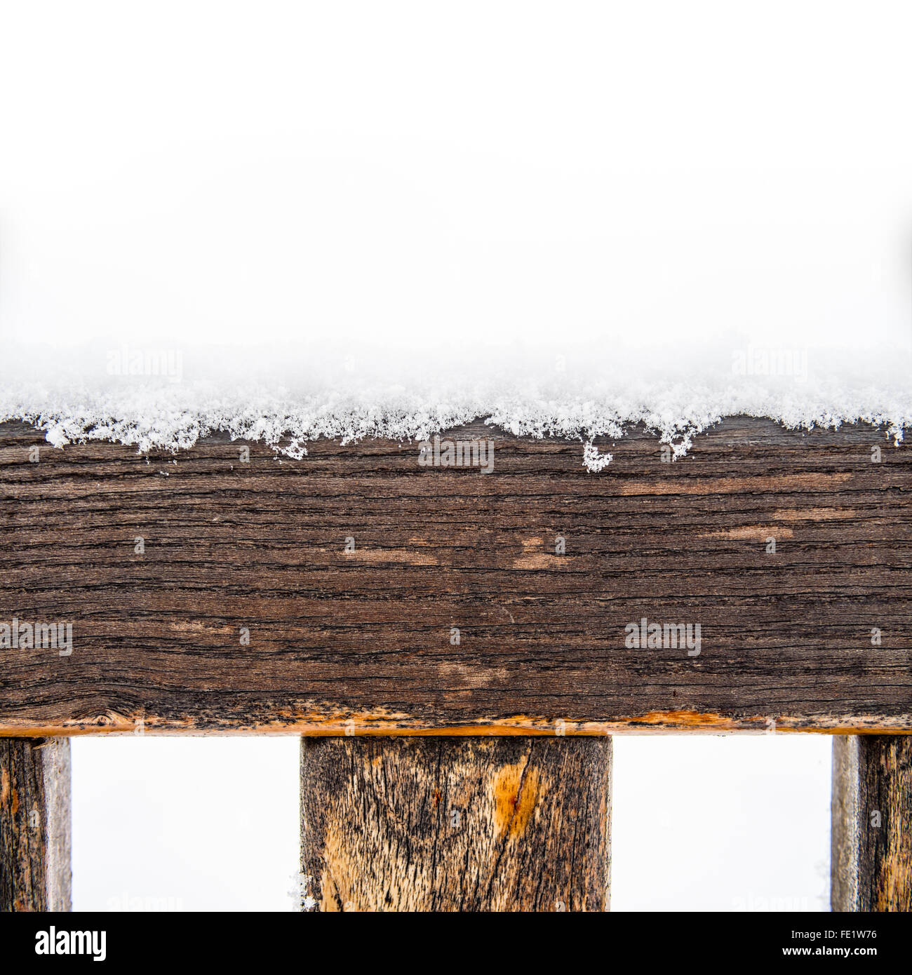 Painted wooden board and rungs covered with snow Stock Photo