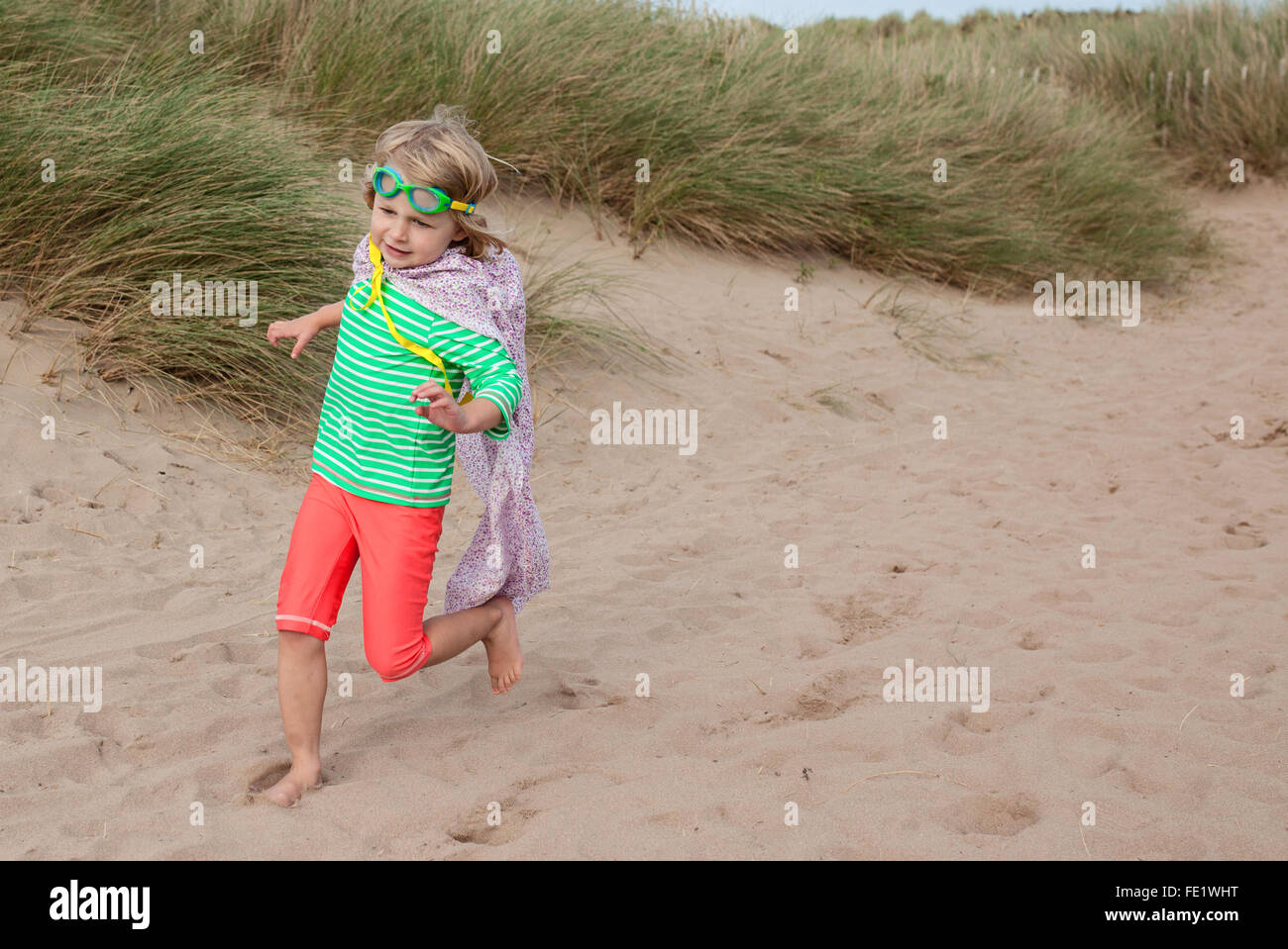 Super Hero Girl On The Beach Stock Photo Alamy