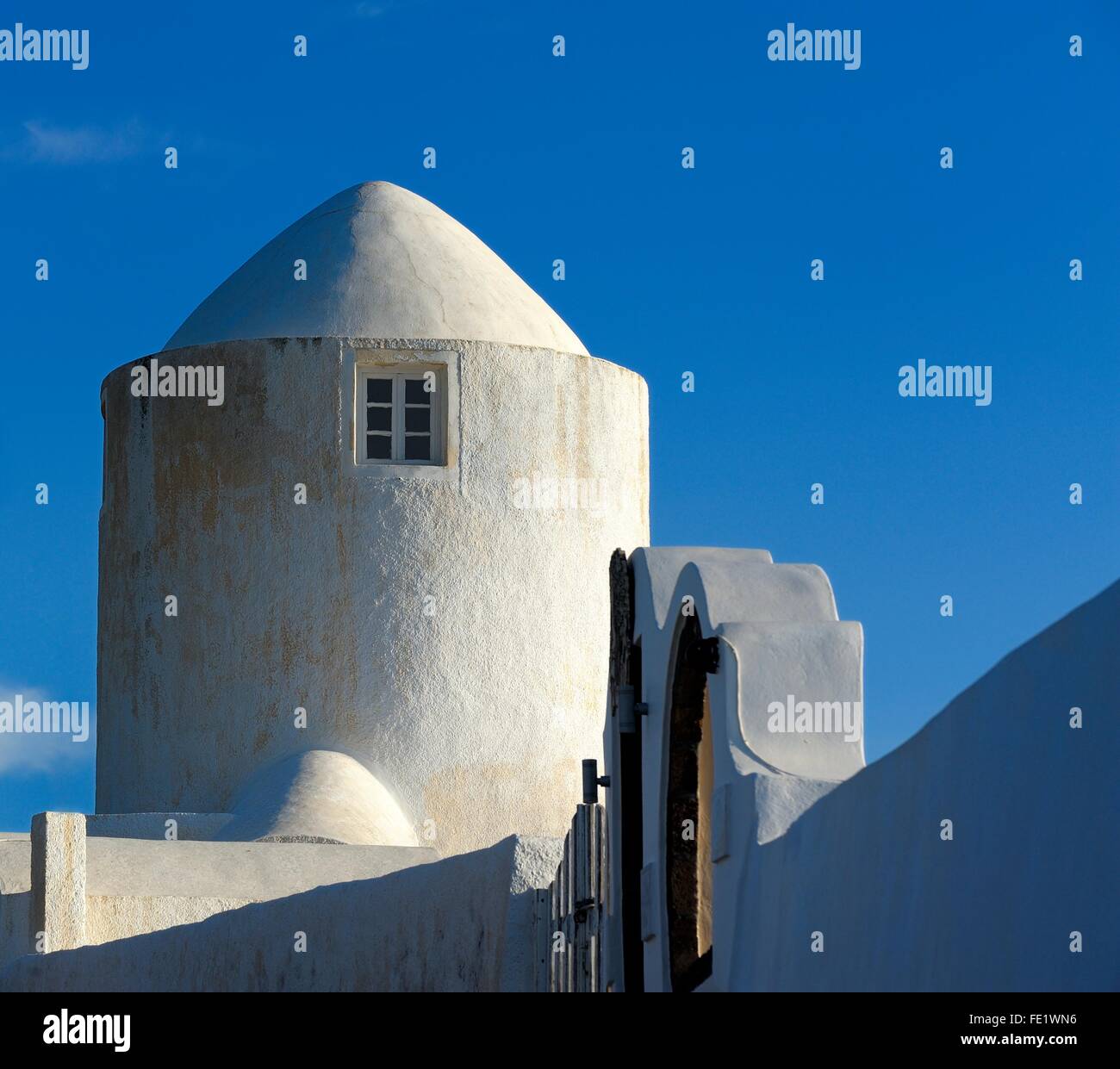 A whitewashed windmill in the village of imerovigi,Santorini,Greece Stock Photo