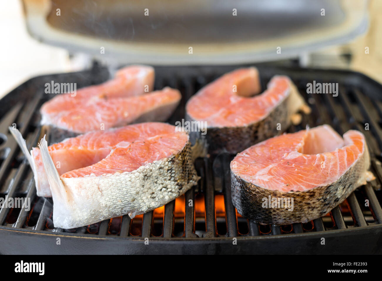 Salmon steaks barbeque cooking on grill Stock Photo Alamy