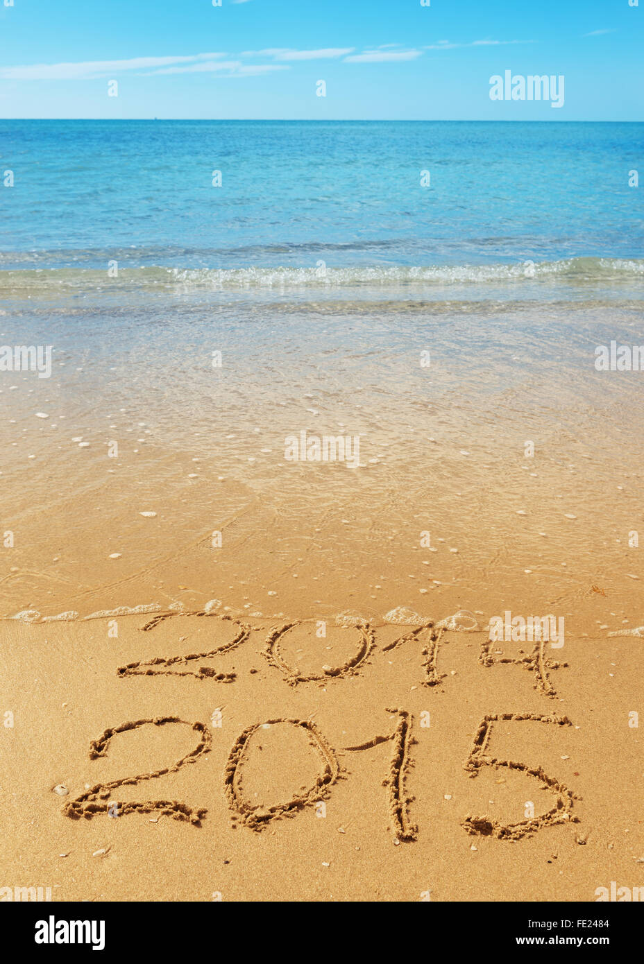 digits  2014 and 2015 on the seashore  sand - concept of new year and passing of time Stock Photo