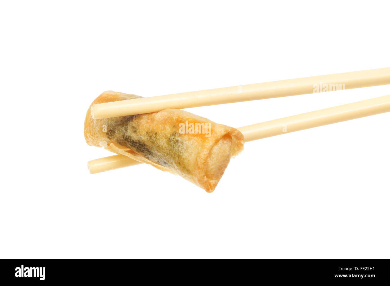 Whole prawn and coriander spring roll held in chopsticks isolated against white Stock Photo