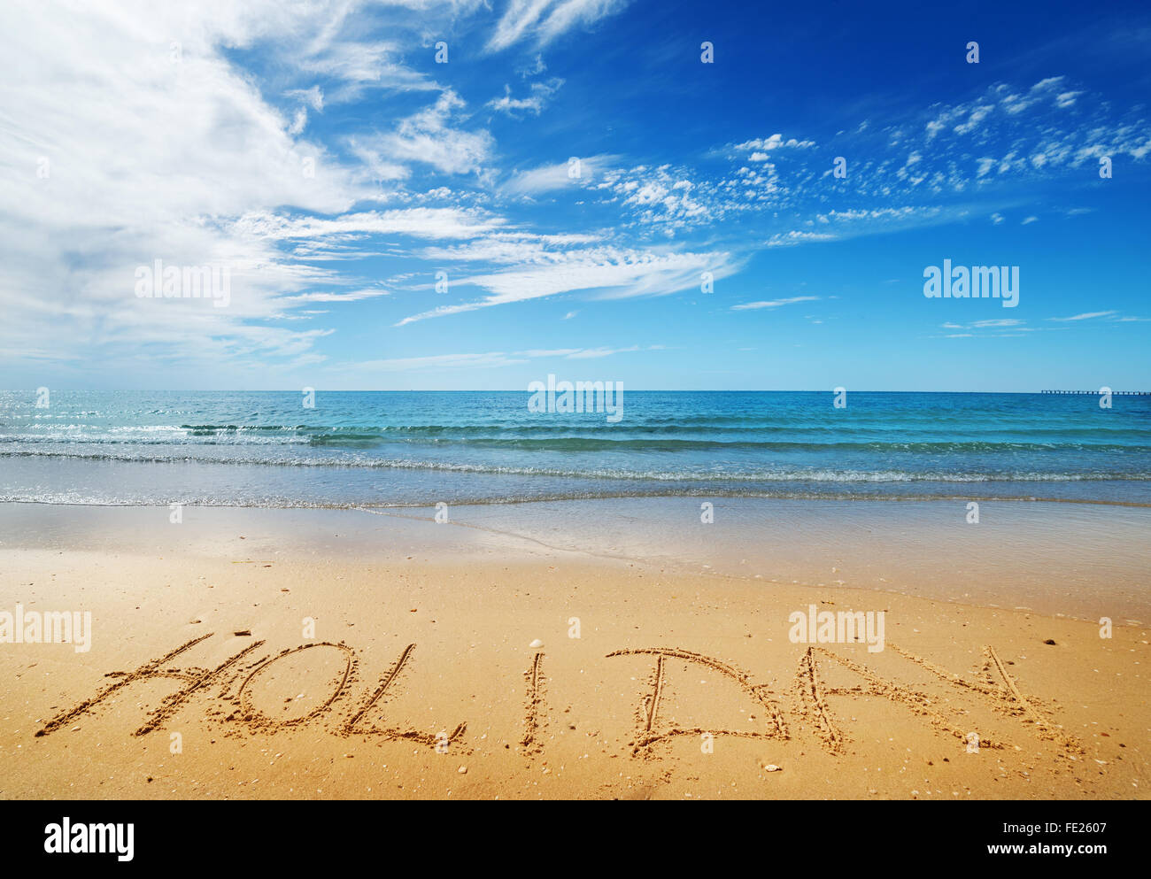 Holiday message on the beach sand - vacation and travel concept Stock Photo
