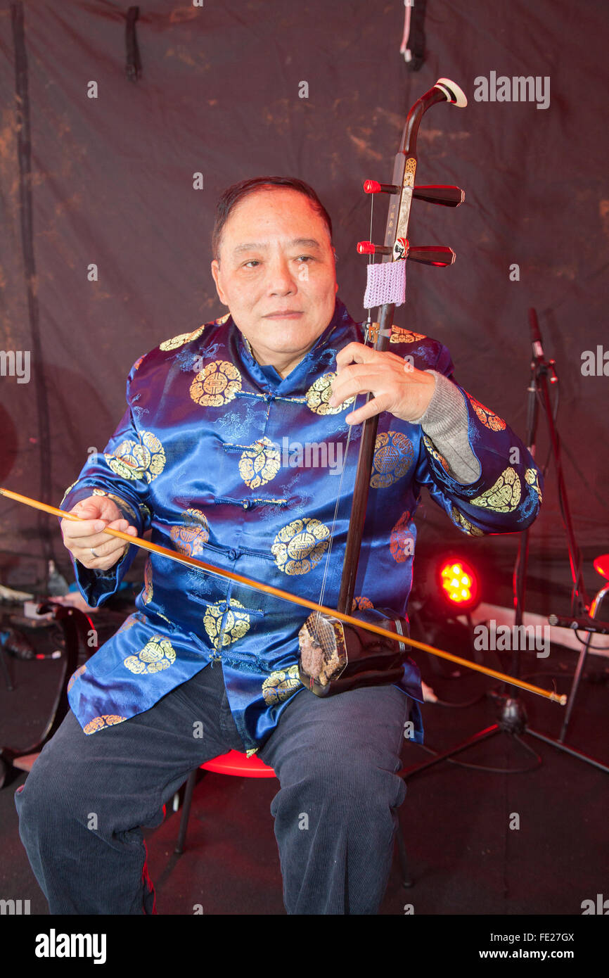 Manchester, UK. 4th Feb 2016. Chinese New Year in St Anne's Sq, Manchester.  Henry Fung playing a traditional a 2 string violin called 'Erhu' Stock Photo