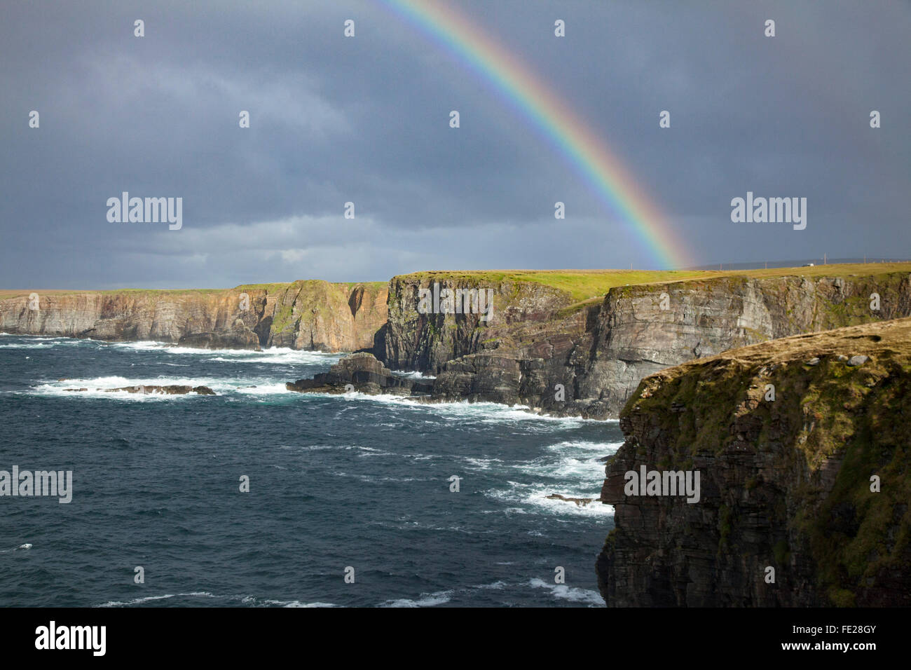 Rainbow over the north Mayo sea cliffs, County Mayo, Ireland. Stock Photo
