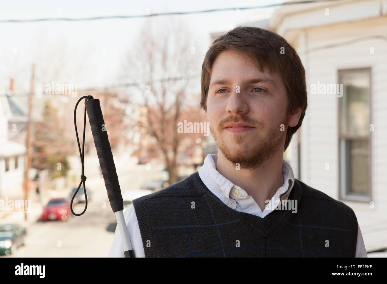 Young blind man walking in town Stock Photo Alamy