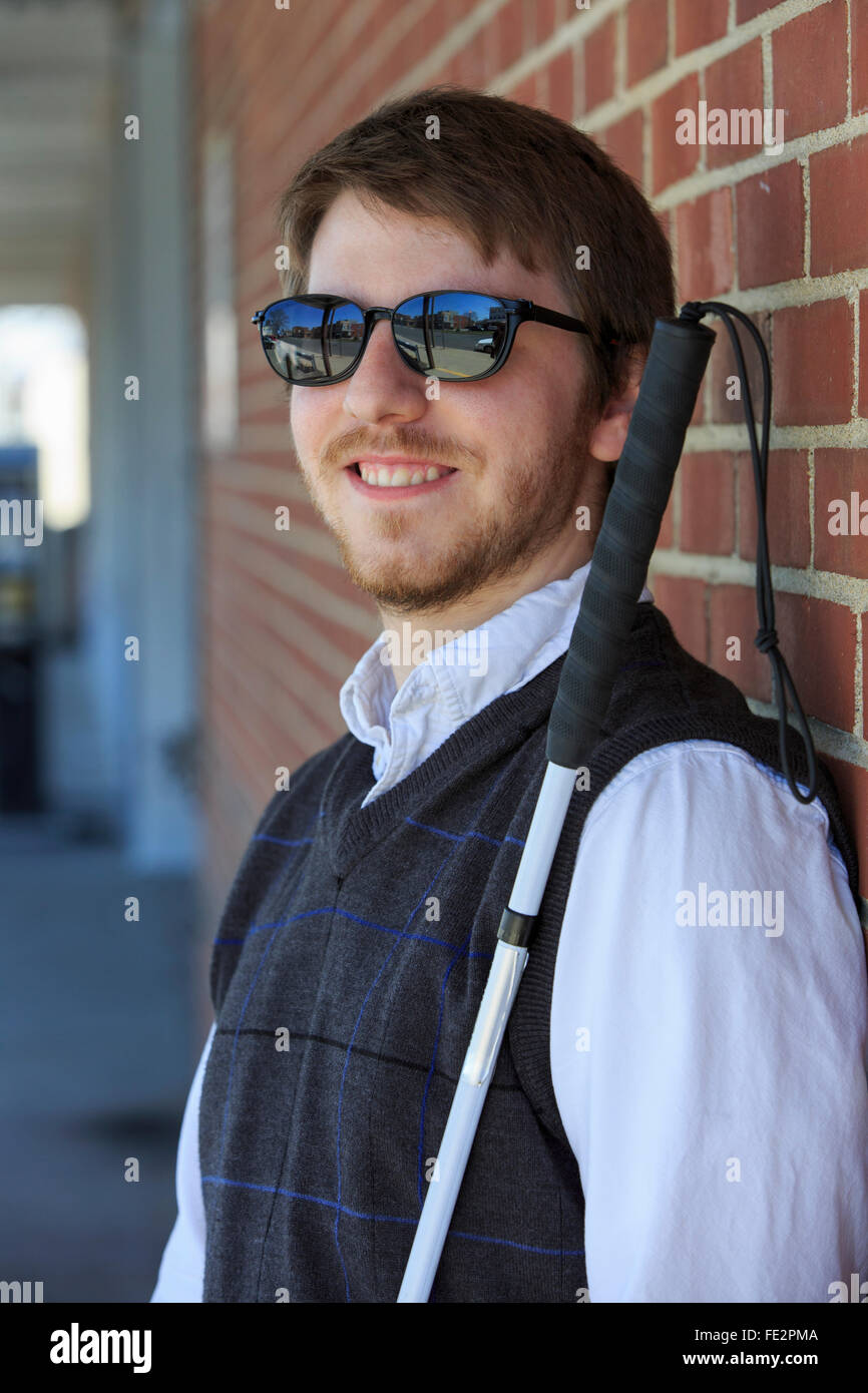 Young blind man with a cane Stock Photo Alamy