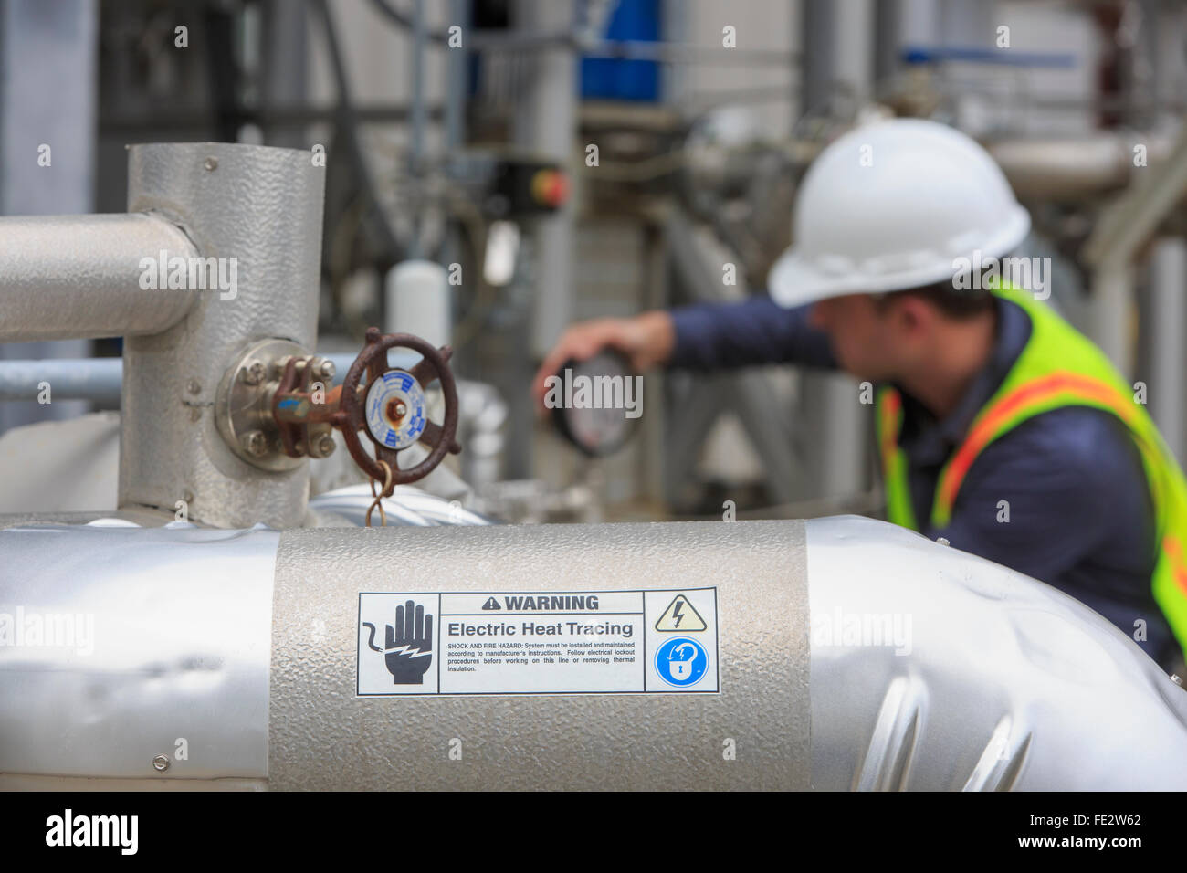 Industrial engineer at analog pressure gauge at a power plant Stock ...