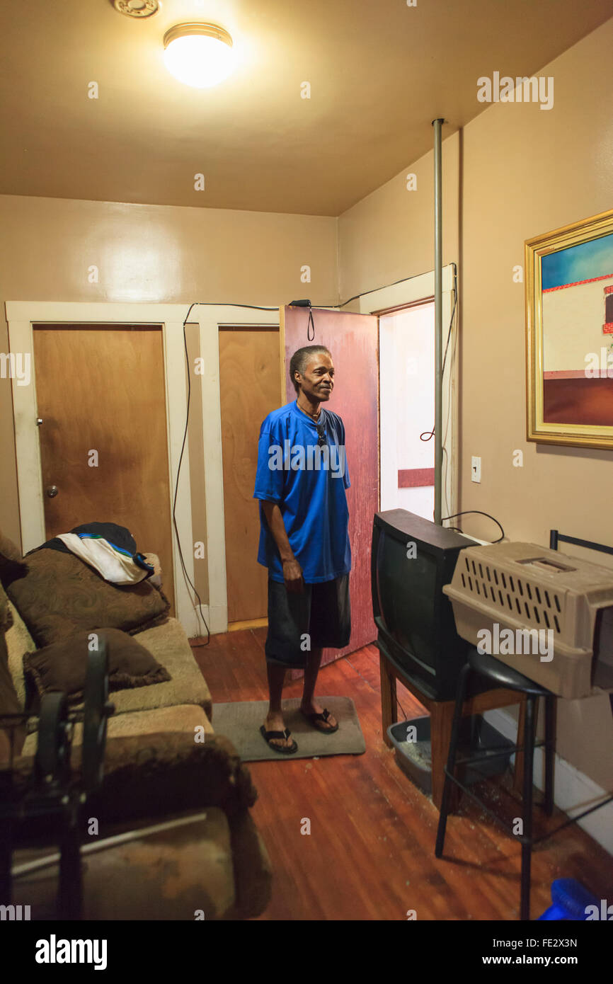 Man with Traumatic Brain Injury in his home Stock Photo