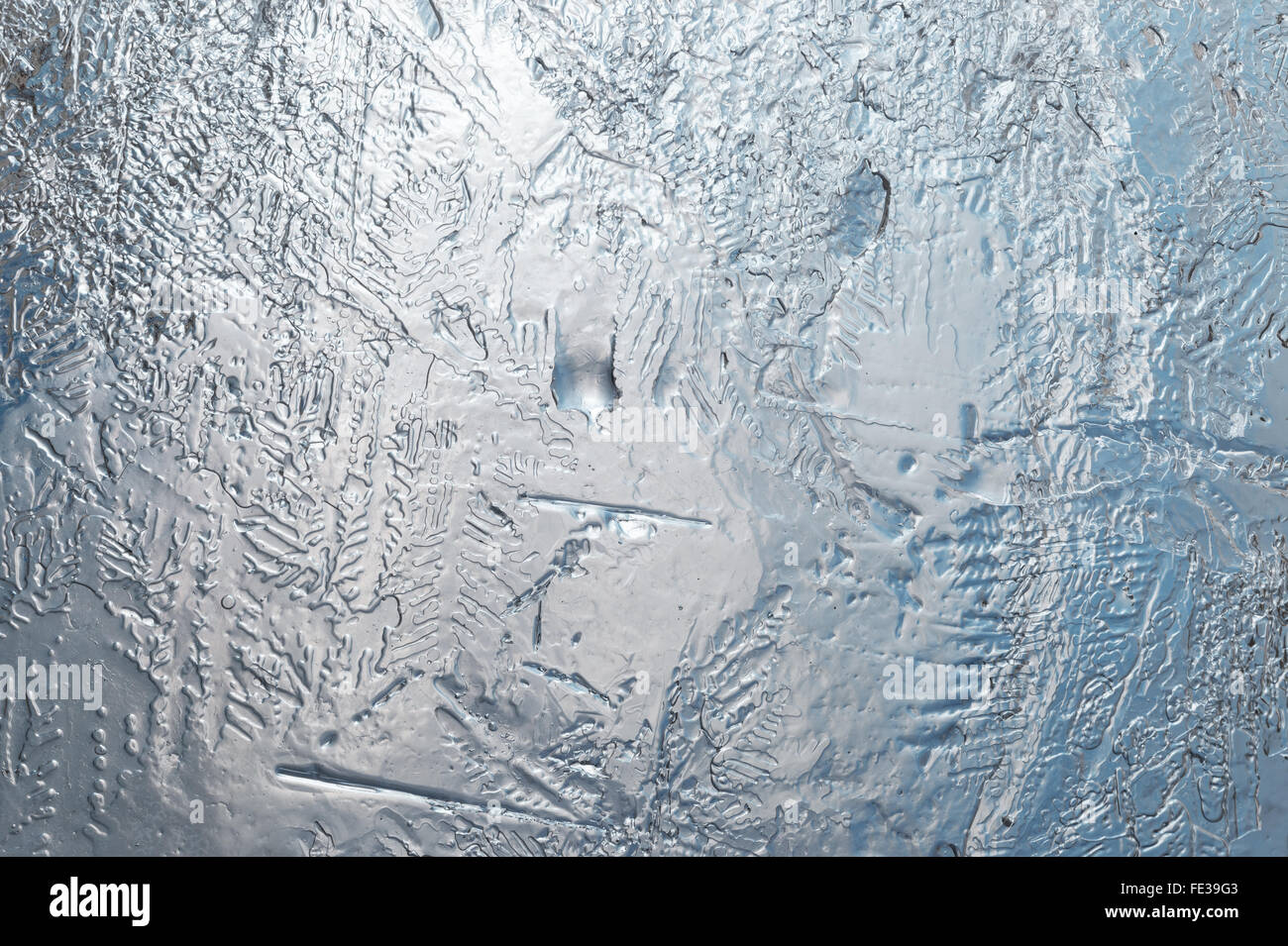 Through a transparent and melting layer of ice Stock Photo