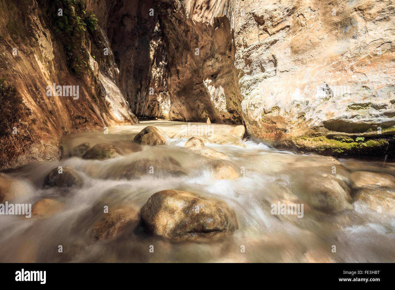 Popular tourist route In river bed Rio Chillar River In Nerja, Malaga, Spain. Water flow, slow motion. Stock Photo