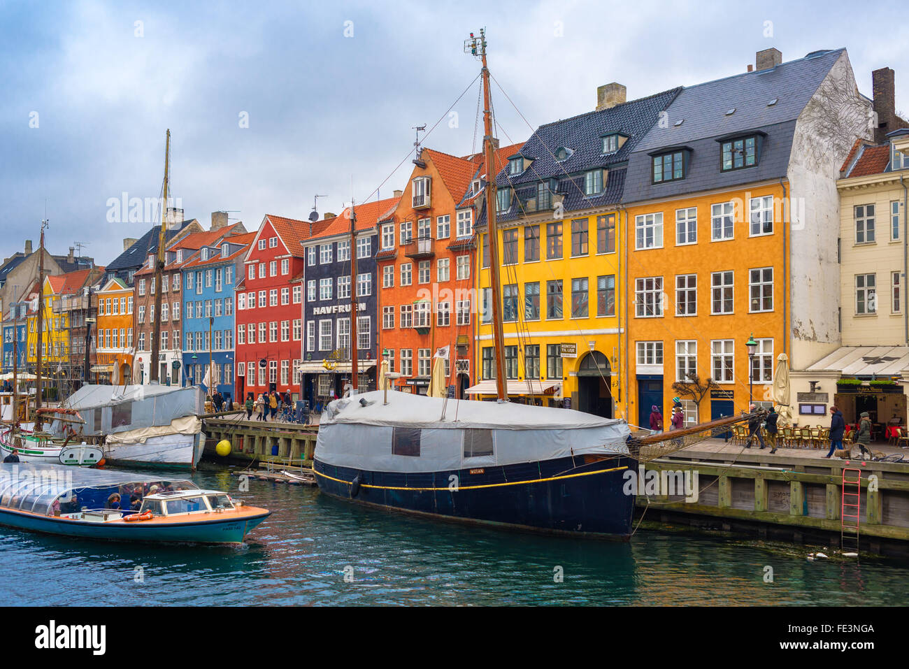 COPENHAGEN, DENMARK - DECEMBER 30, 2015: Copenhagen Nyhavn canal and promenade with its colorful facades Stock Photo