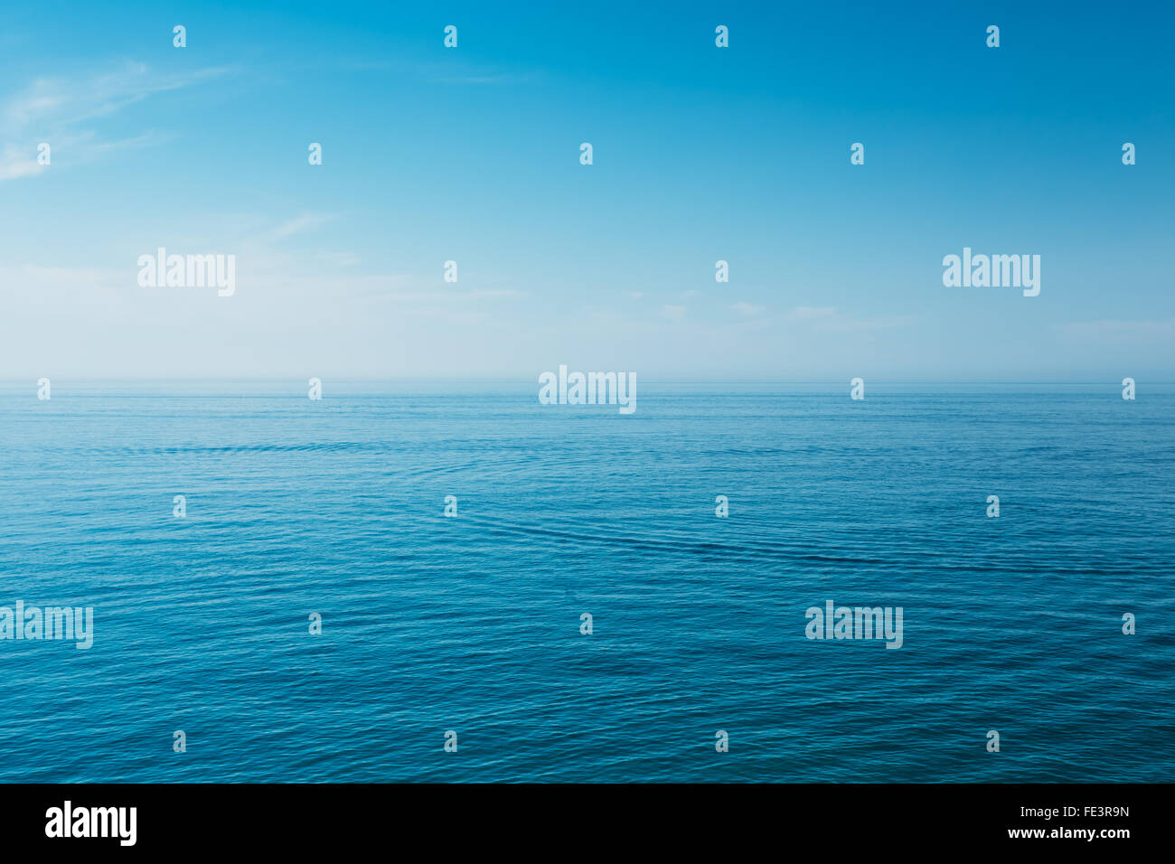 Calm Sea Ocean And Blue Sky Background Stock Photo - Alamy