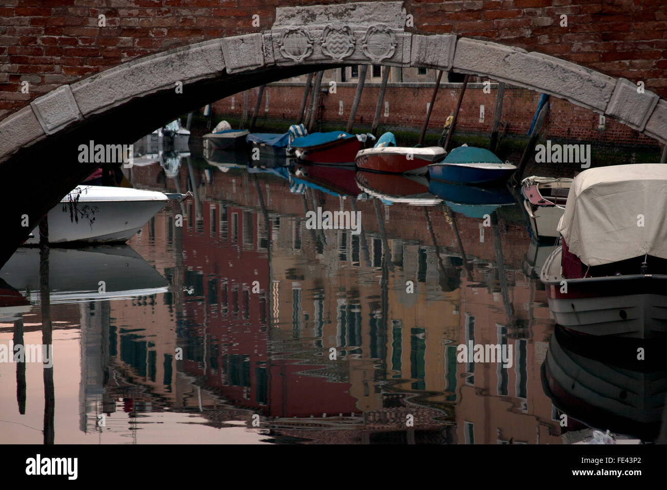 Reflections in the canal water under a bridge, Venice Italy Stock Photo ...