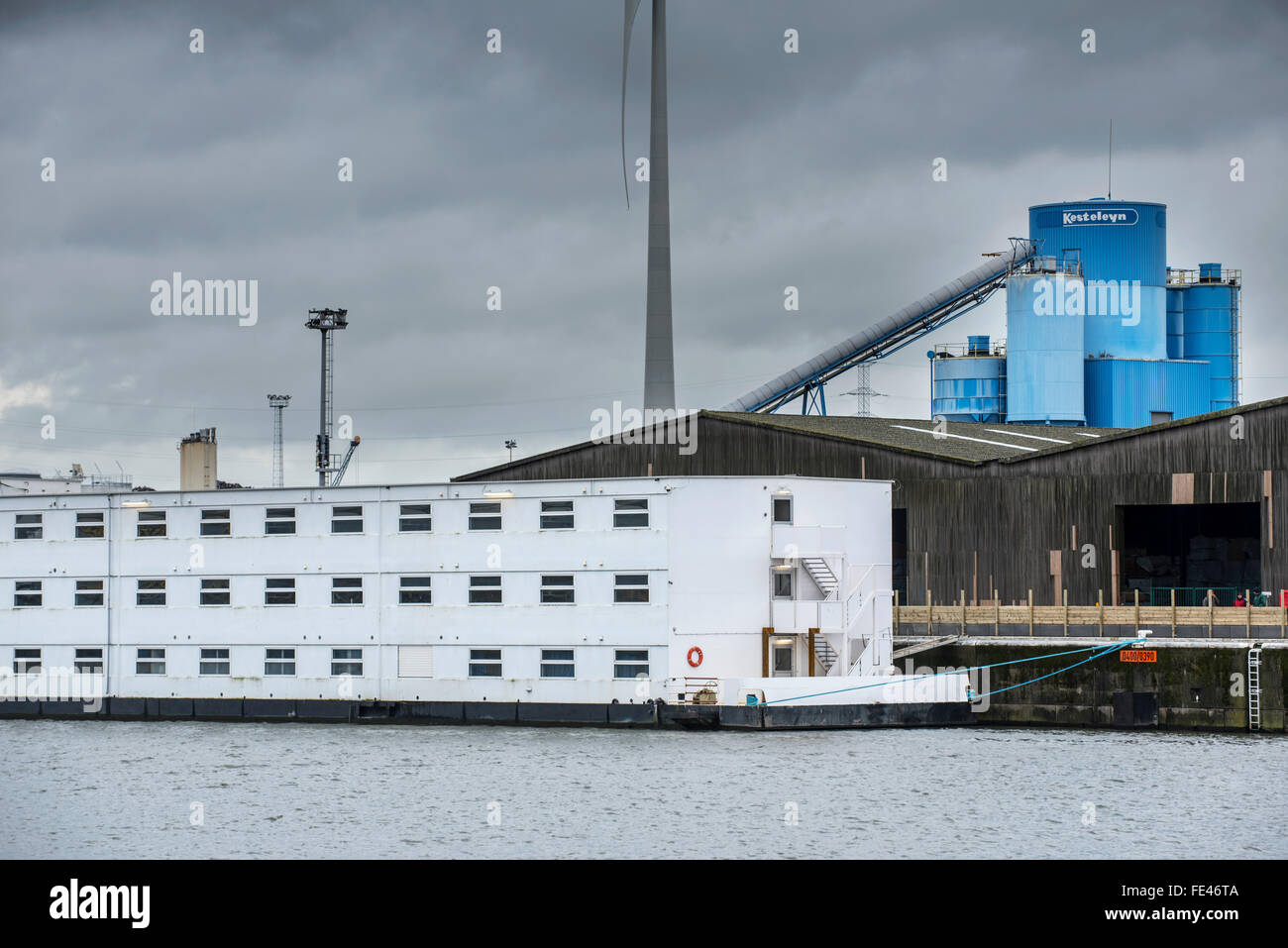 Ghent, Belgium, 04th February, 2016. Arrival of pontoon De Reno in the Ghent port. Former floating prison from the Netherlands will now be used to accommodate up to 250 asylum seekers at the Rigakaai dock in the harbour of Ghent, Belgium Credit:  Arterra Picture Library/Alamy Live News Stock Photo