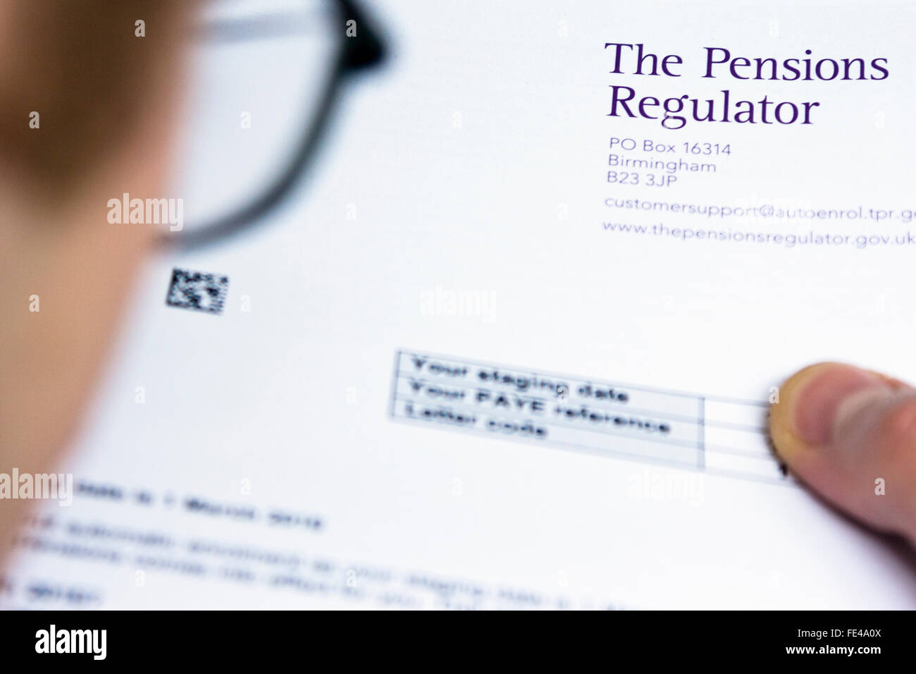 Employer looking at information about the UK government's Pensions Regulator Stock Photo