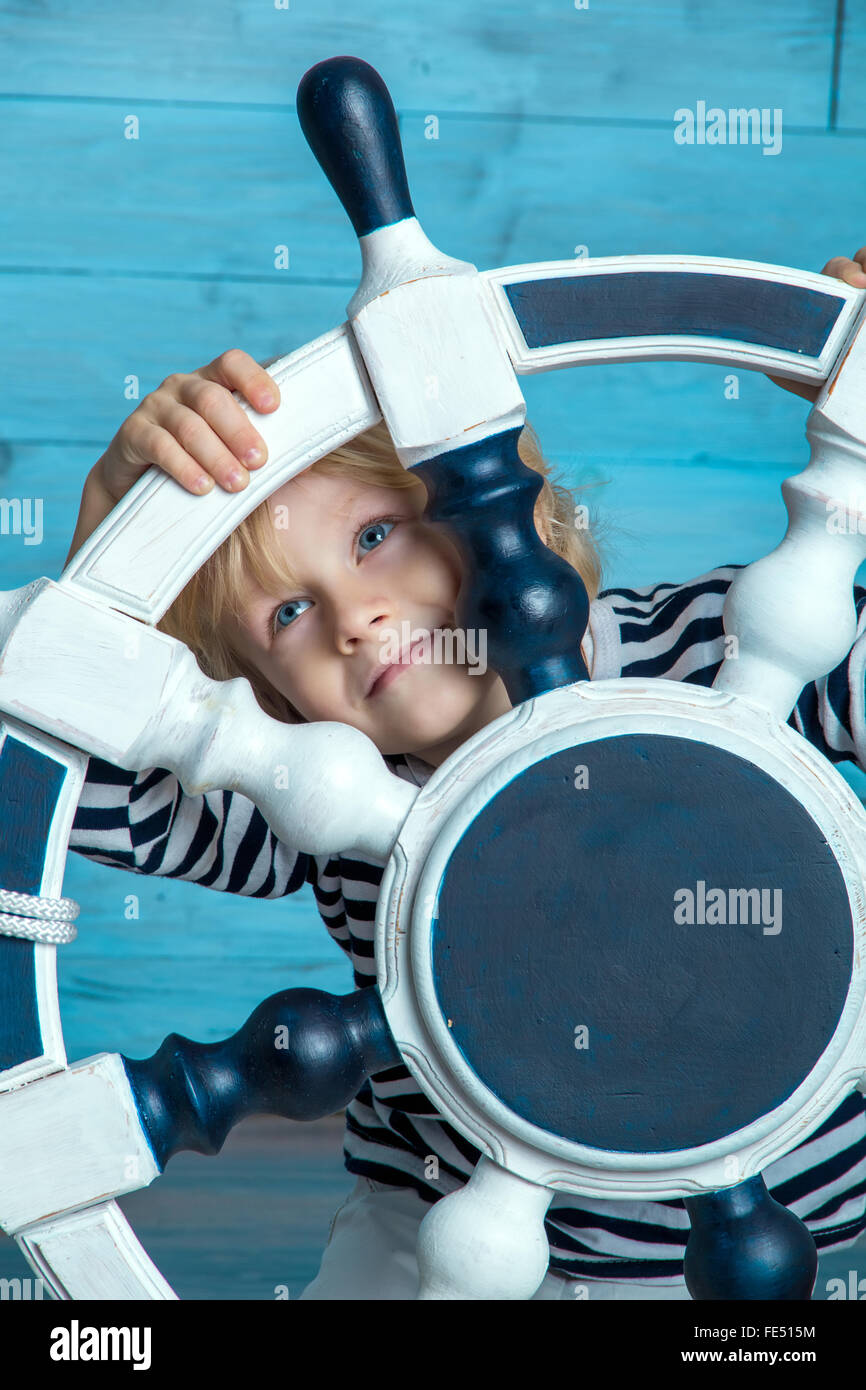 child looking through the wheel Stock Photo
