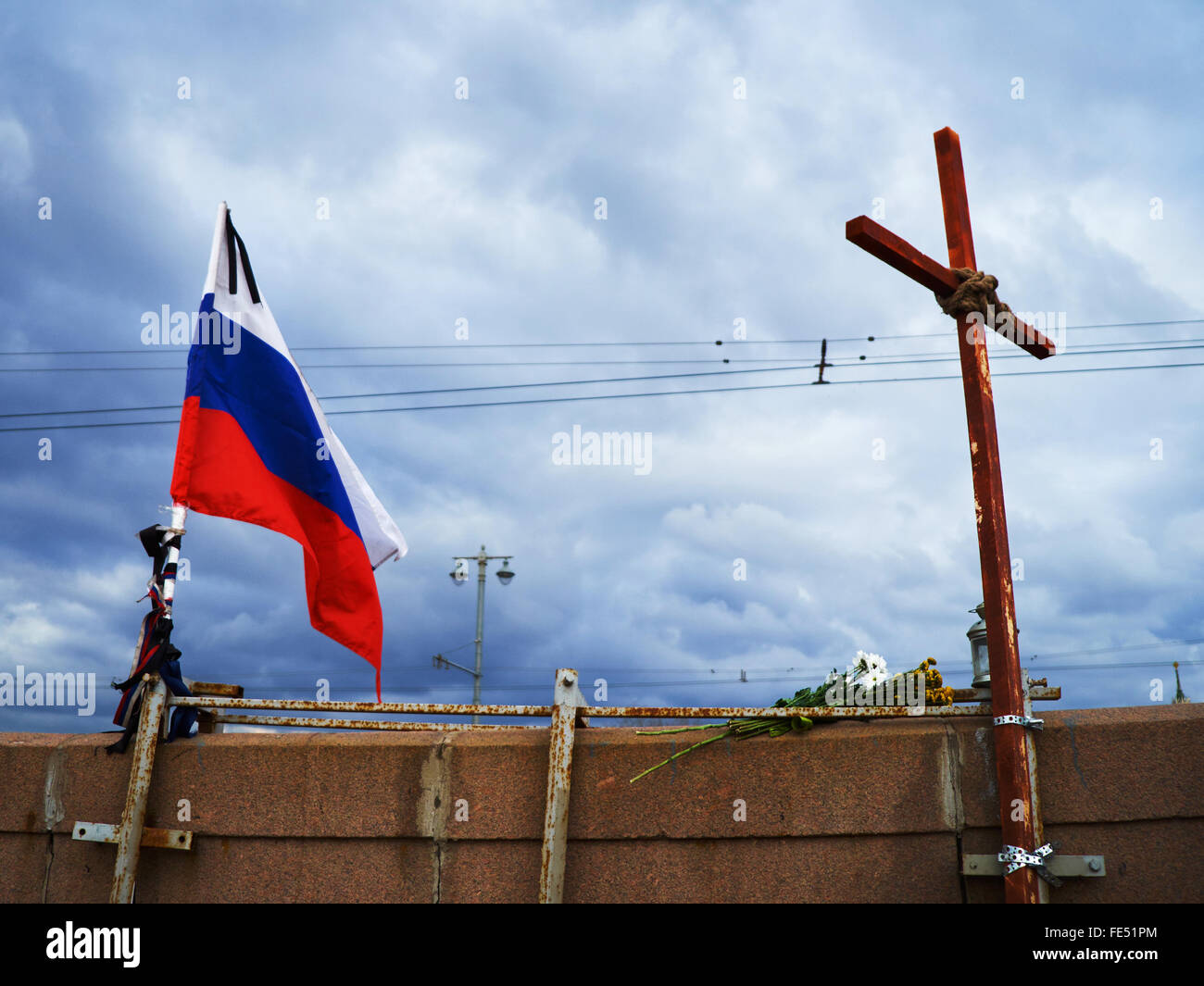 Moscow, Russian Federation - APRIL 2, 2015, Cross and Russia flag at bridge where Boris Nemtsov was killed on February 27, 2015 Stock Photo
