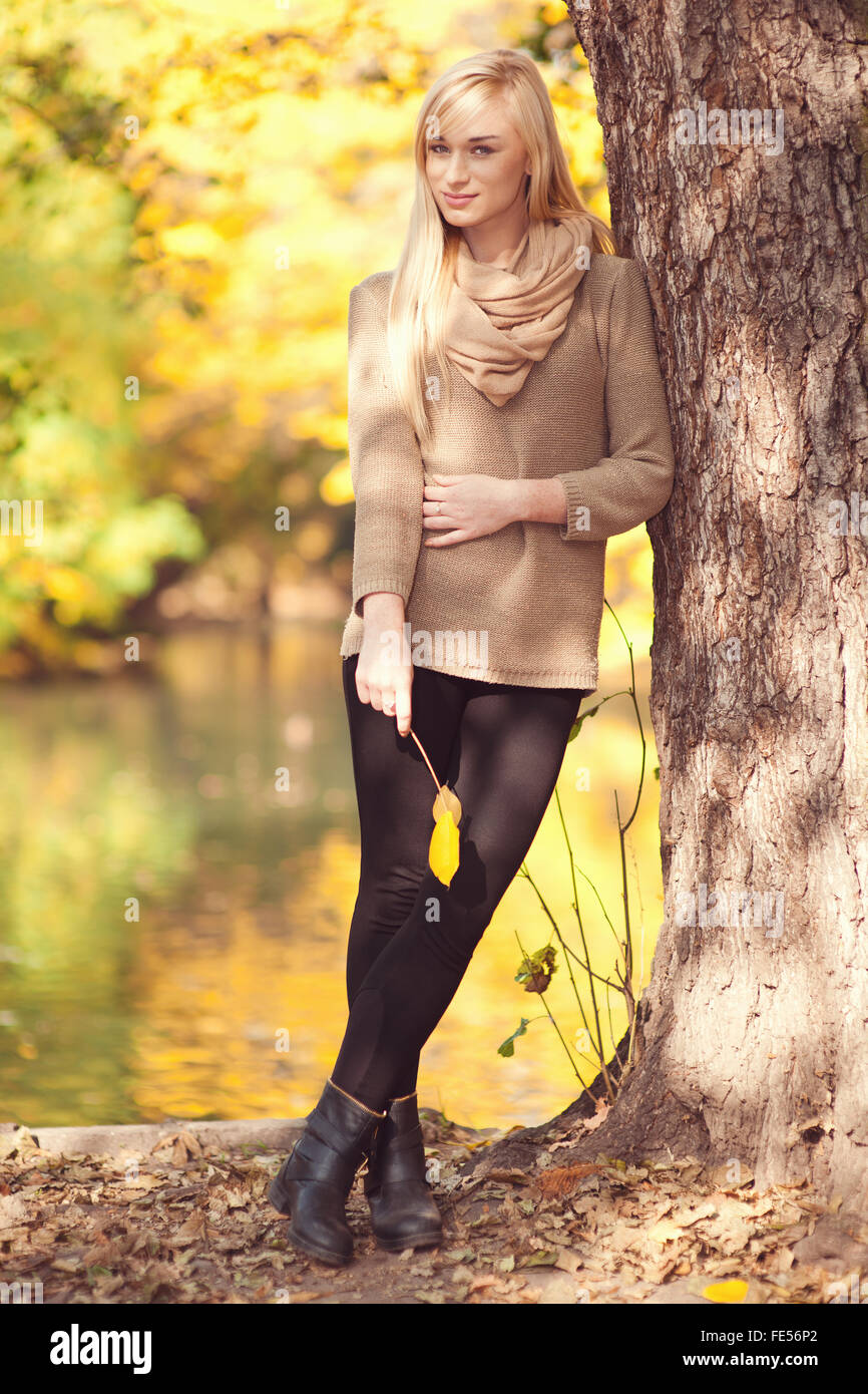 Beautiful young blond woman - colorful autumn portrait Stock Photo - Alamy