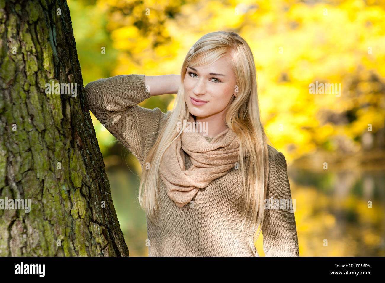 Beautiful young blond woman - colorful autumn portrait Stock Photo - Alamy