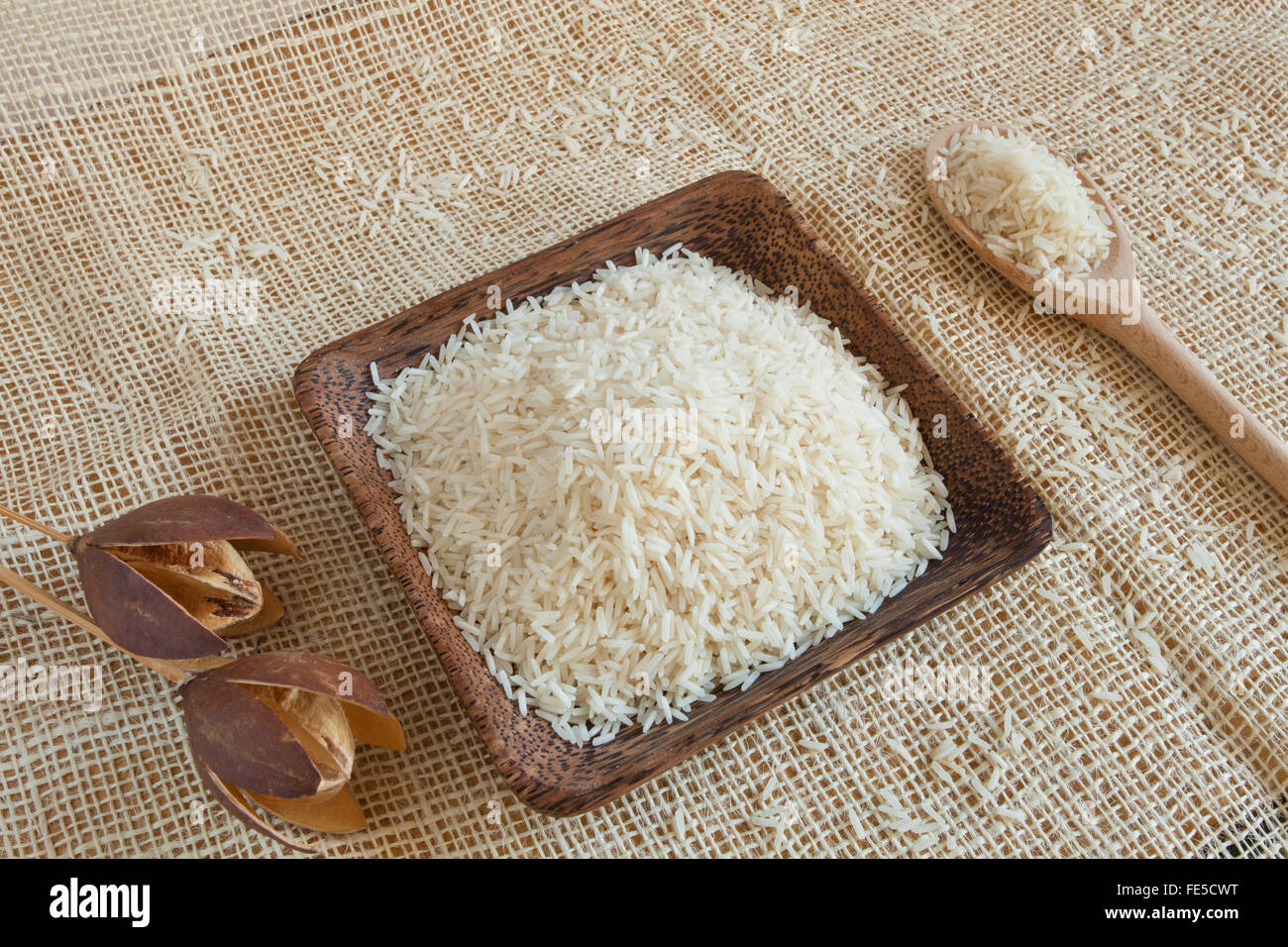 Uncooked Basmati rice in a wooden cup Stock Photo Alamy