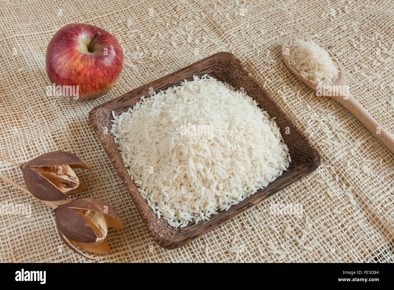 Uncooked Basmati rice in a wooden cup Stock Photo Alamy