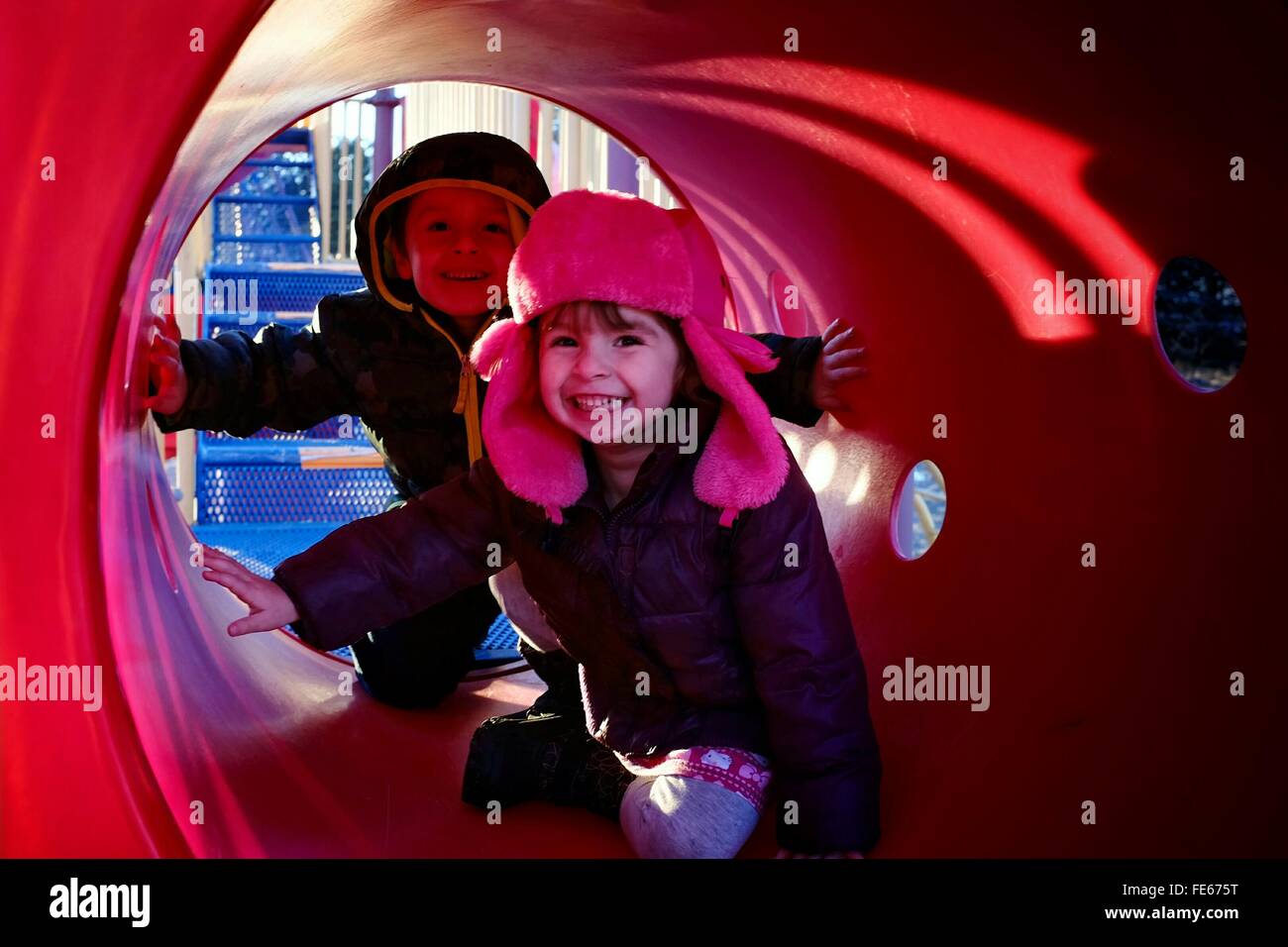 Children In Playground Tunnel Stock Photo