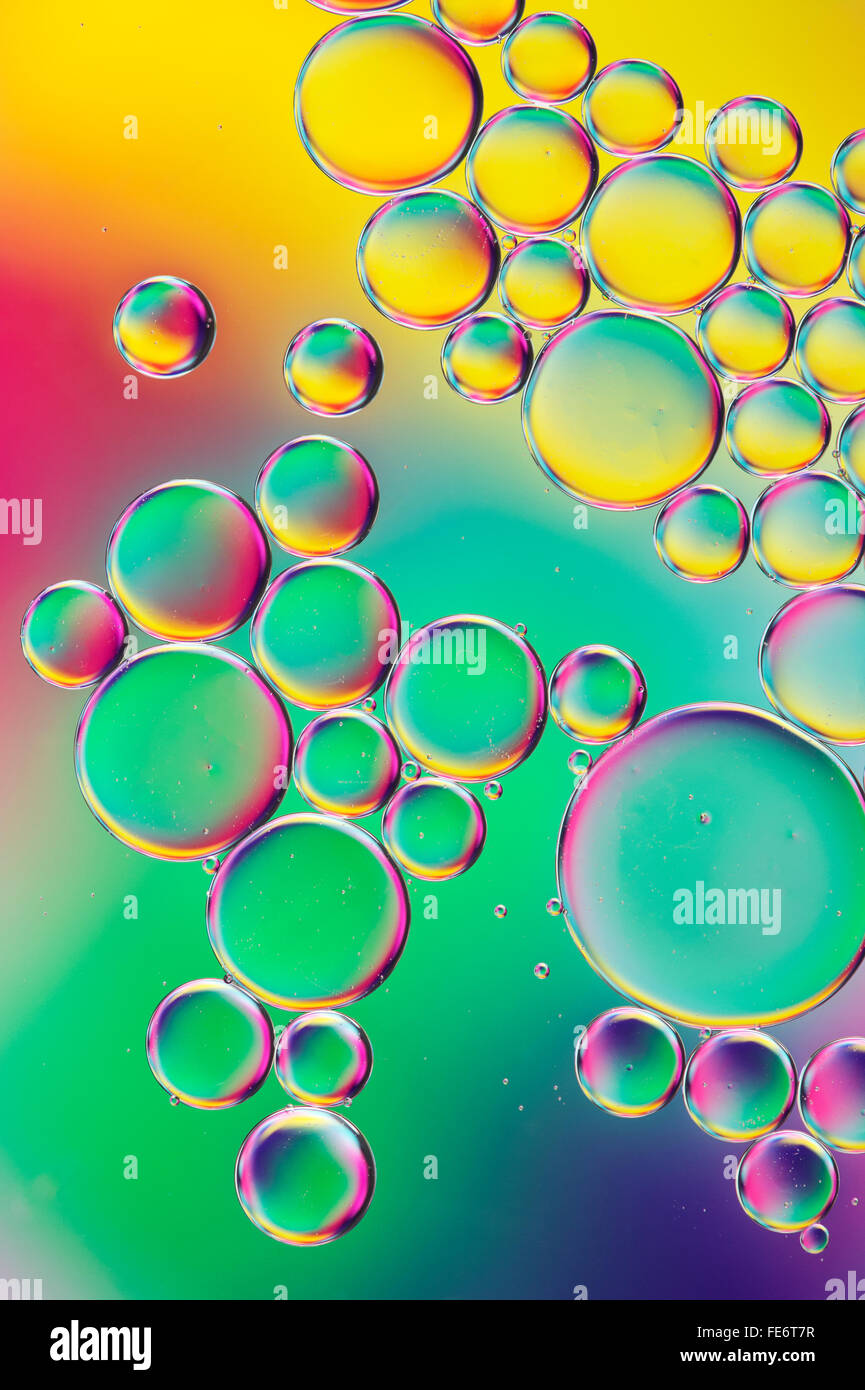 Oil on water with colourful background Stock Photo