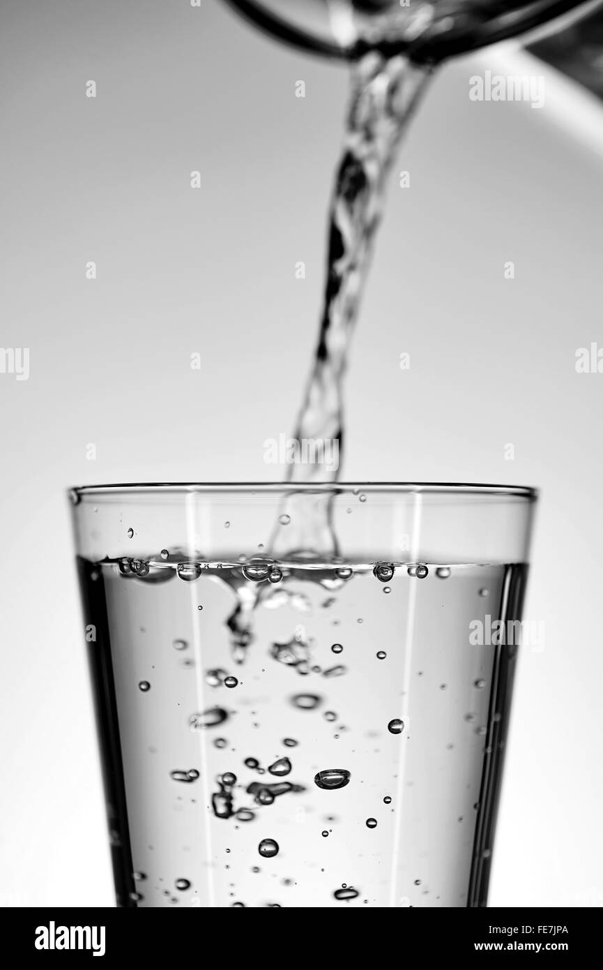 A studio photo of a tall water glass Stock Photo Alamy
