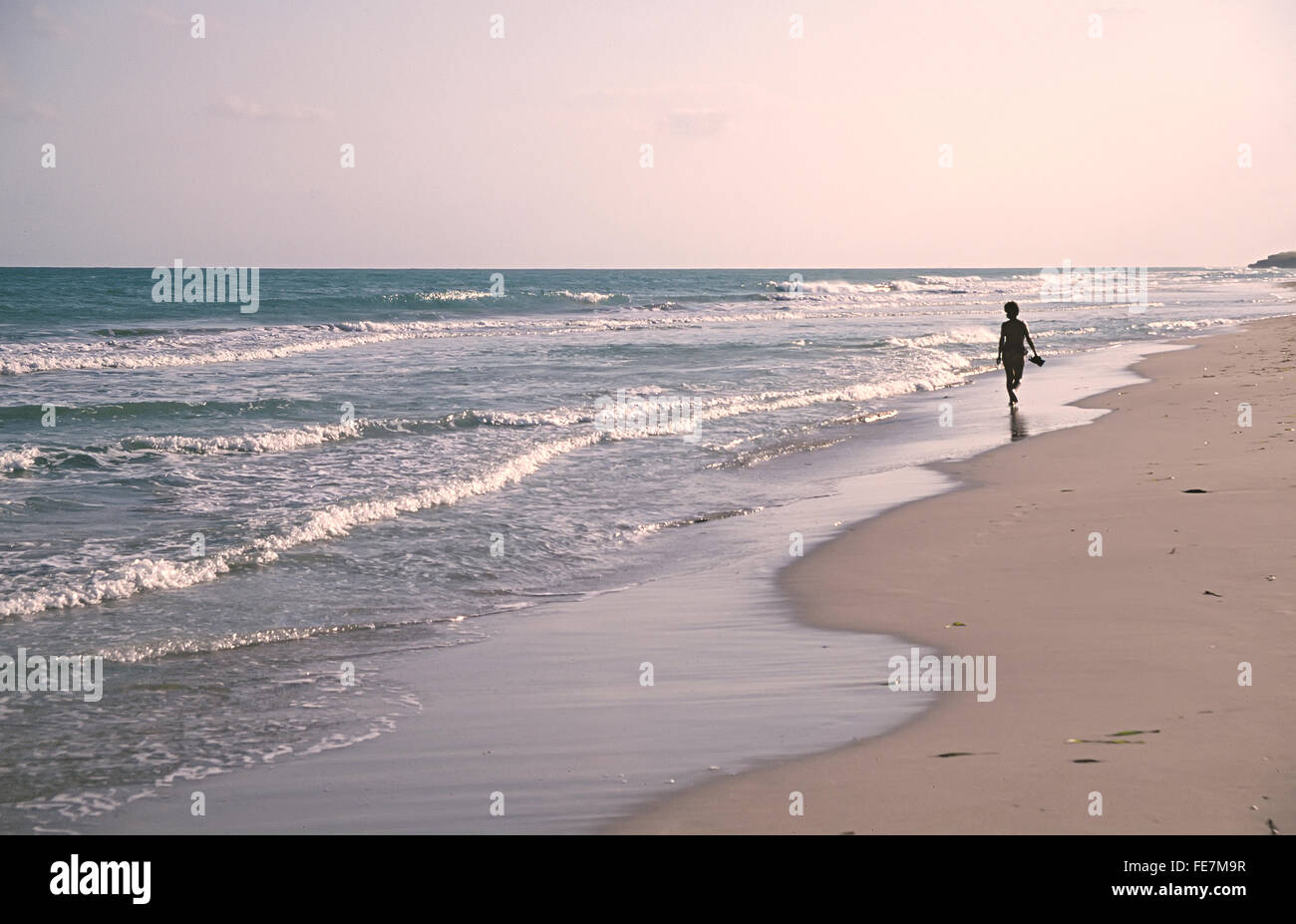 Person walking on beach, Cuba Stock Photo