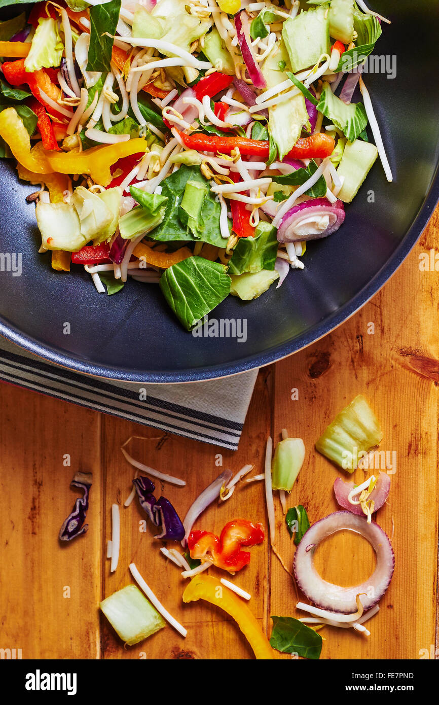 Stir fry wok with vegetables on a wooden table Stock Photo Alamy