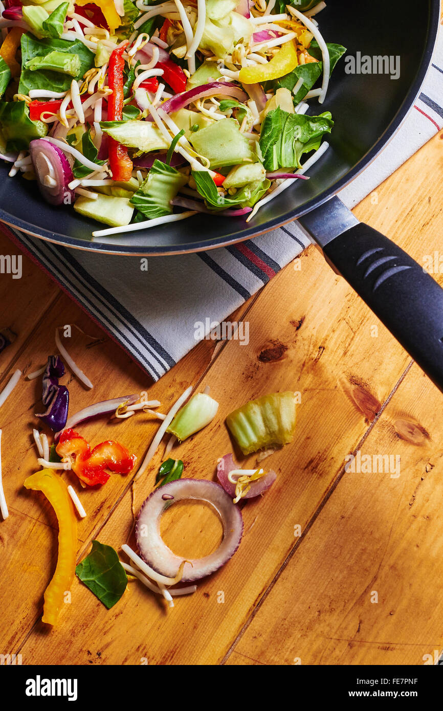 Stir fry wok with vegetables on a wooden table Stock Photo Alamy