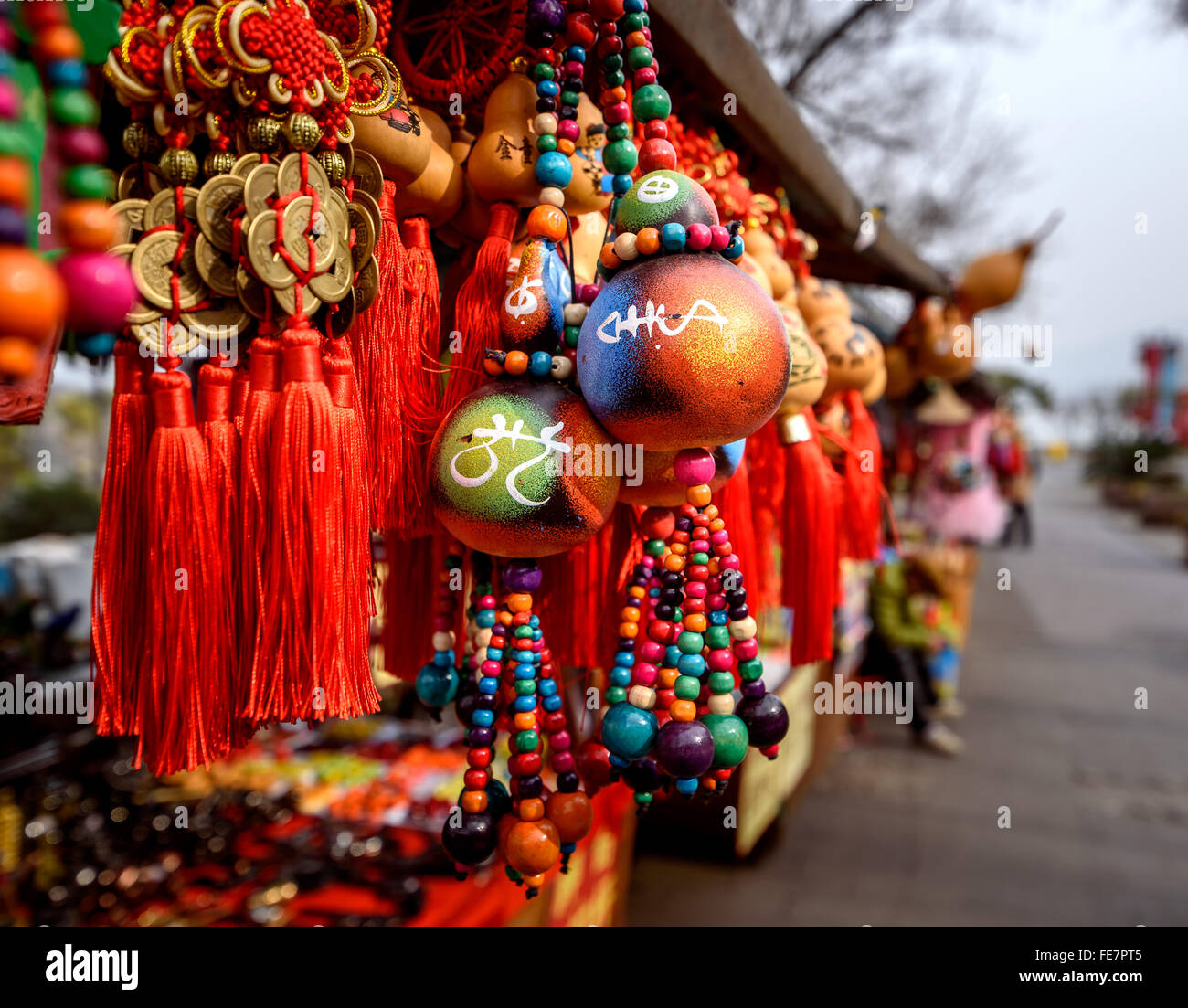 Chinese market stall selling souveniers and traditional Chinese decorative goods. Stock Photo