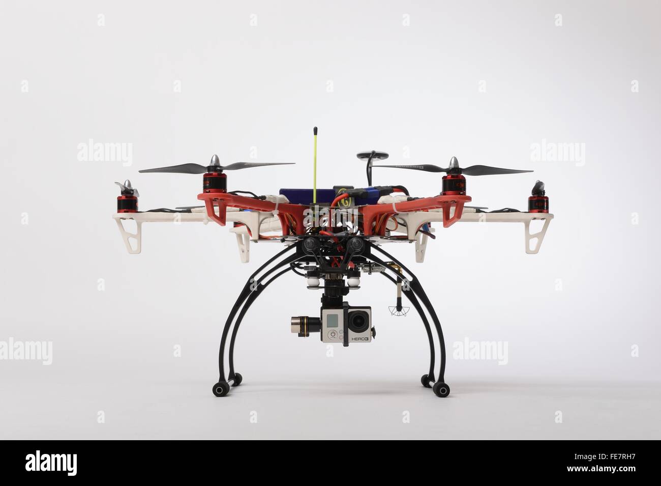 Small multirotor drone of the hexacopter type equipped with a stabilized gimbal holding a GoPro  typically used by hobbyists Stock Photo