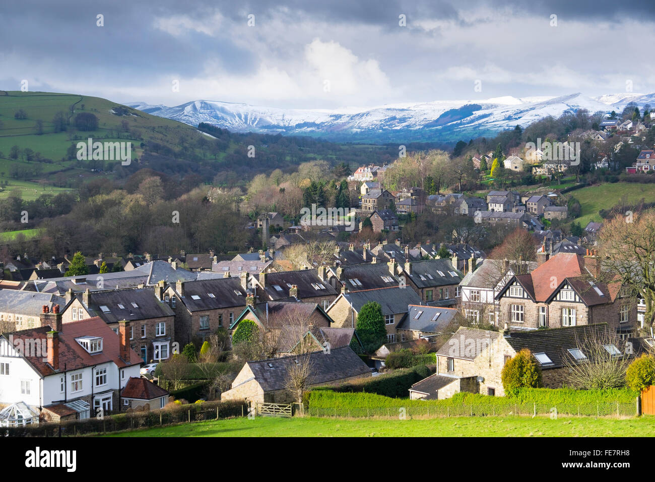 Hathersage in the Peak District in Derbyshire  beneath snow covered Mam Tor and Lose hill. Stock Photo