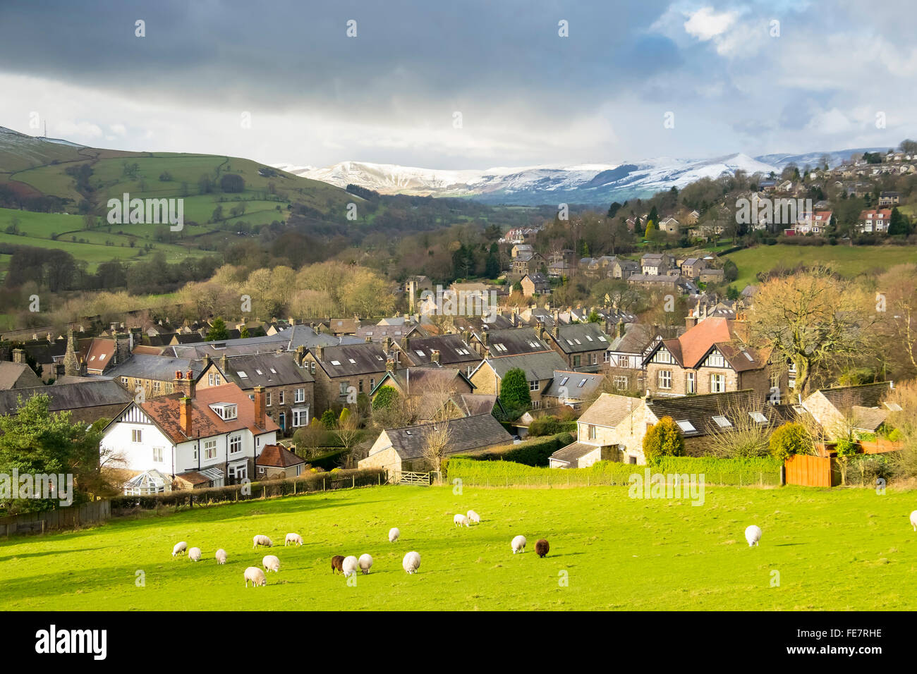 Hathersage in the Peak District in Derbyshire  beneath snow covered Mam Tor and Lose hill. Stock Photo