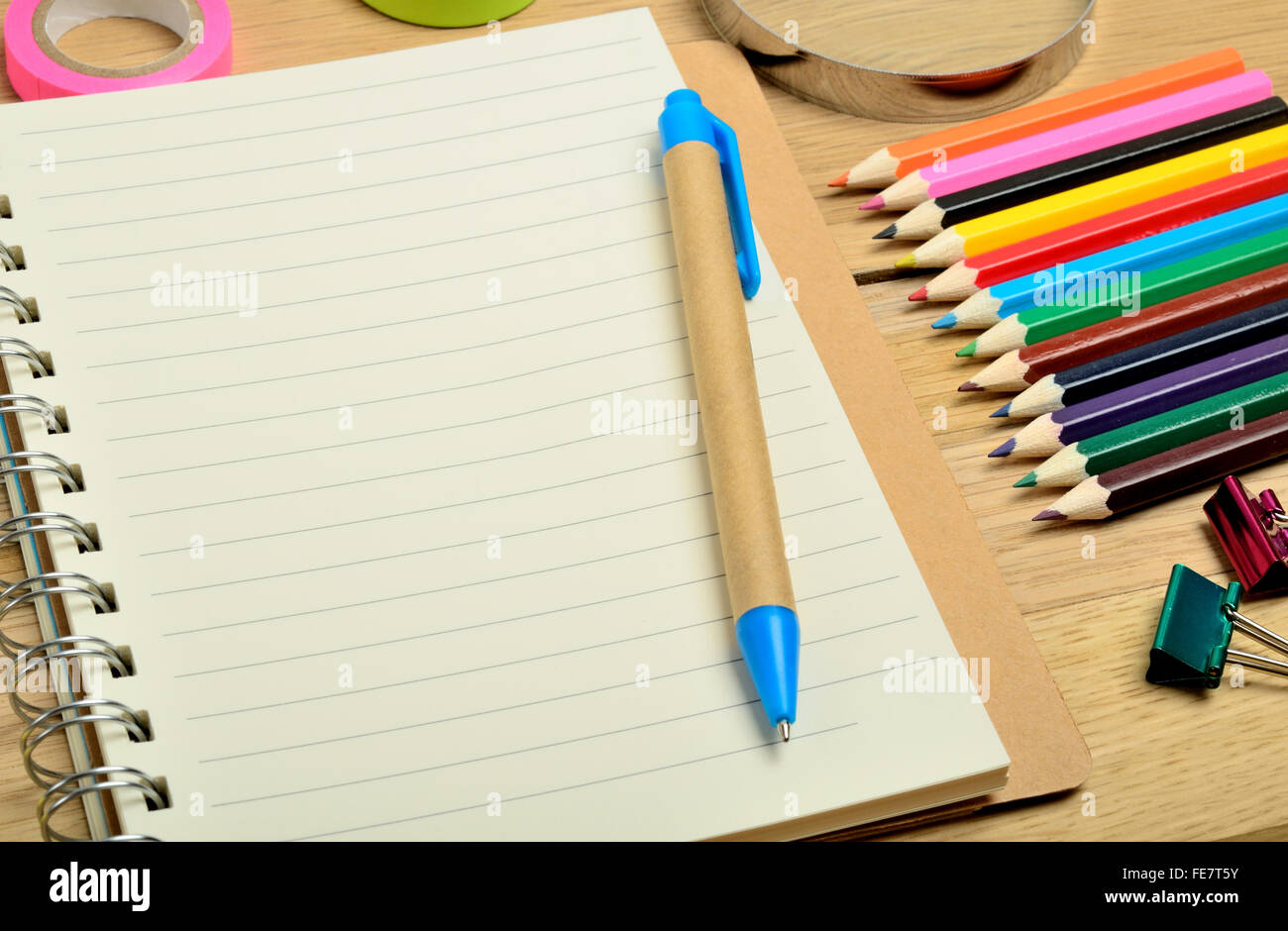 Empty notepad with office supply on wooden table Stock Photo