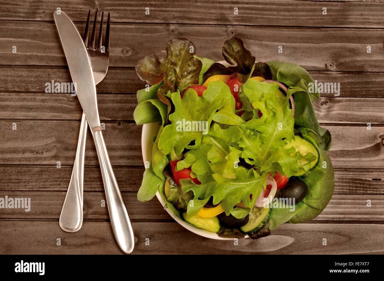 Bowl with vegetabe salad on table Stock Photo