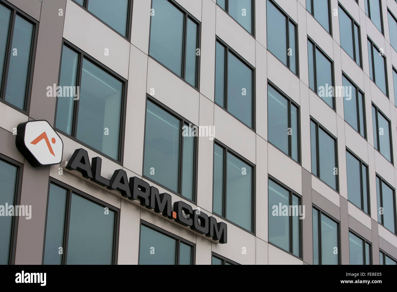 A logo sign outside of the headquarters of Alarm.com, Inc., in Tysons, Virginia on January 1, 2016. Stock Photo